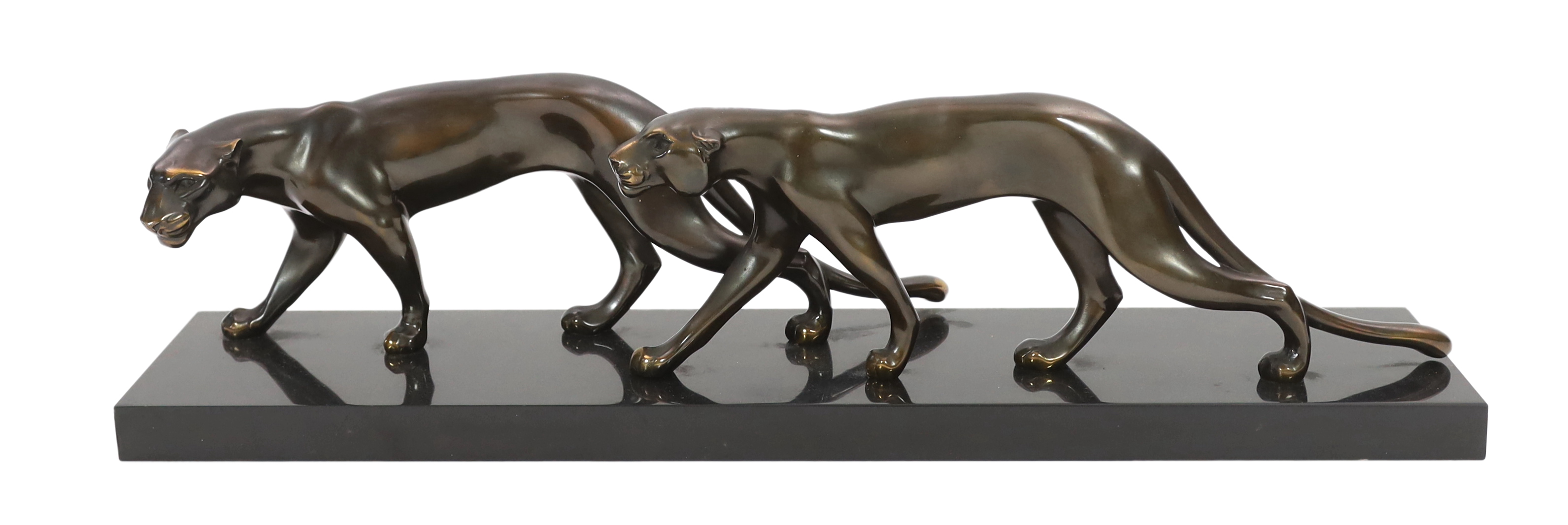 Marty Font, a French Art Deco bronzed and black marble group of two prowling panthers, 68cm wide, 18cm high